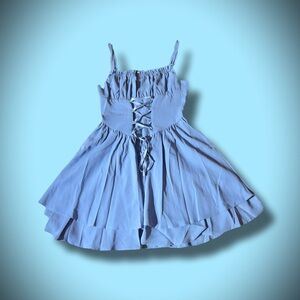 This adorable pastel blue mini dress is calling for a home!